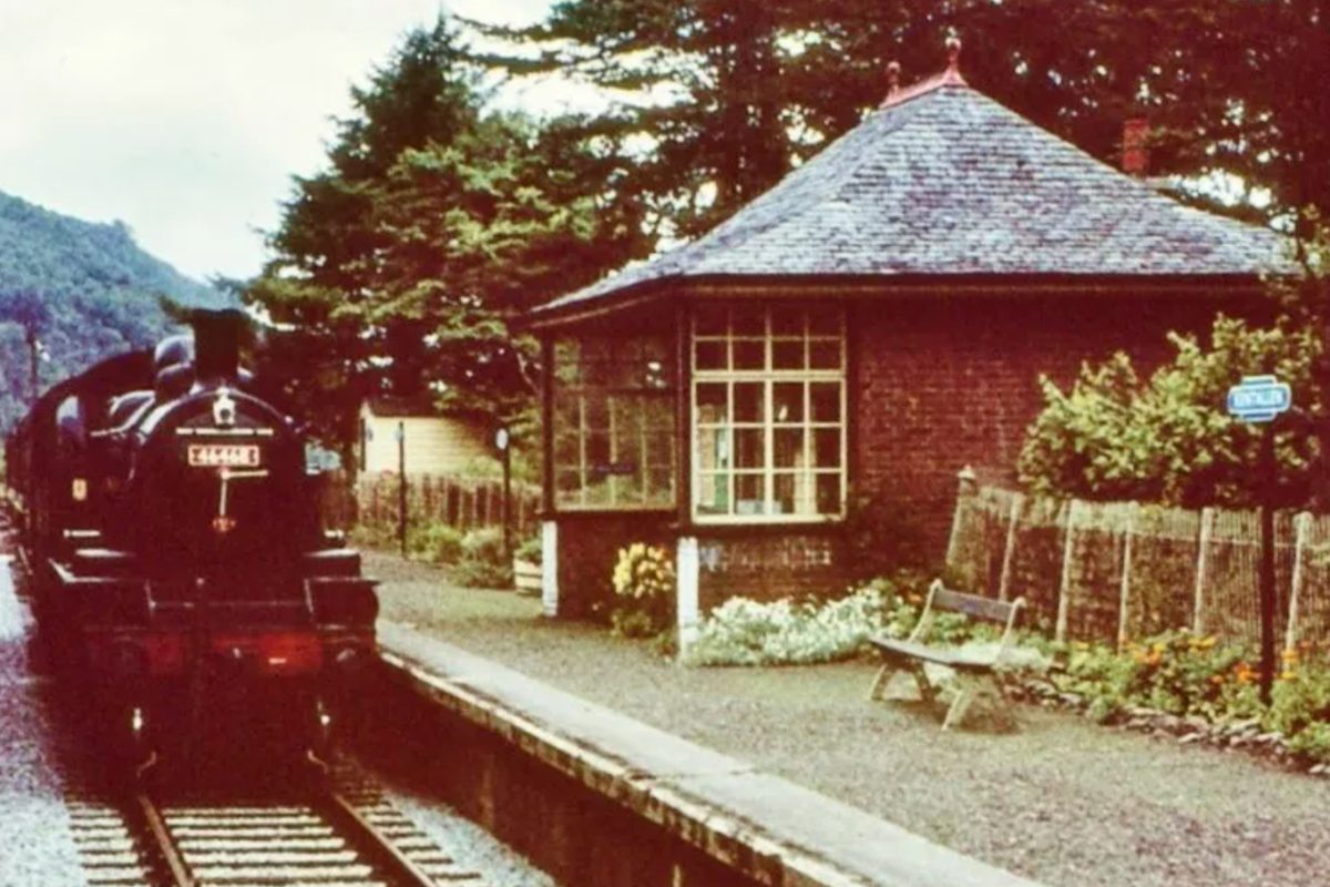 Colour photograph of a steam locomotive at the platform at Kentallen Station
