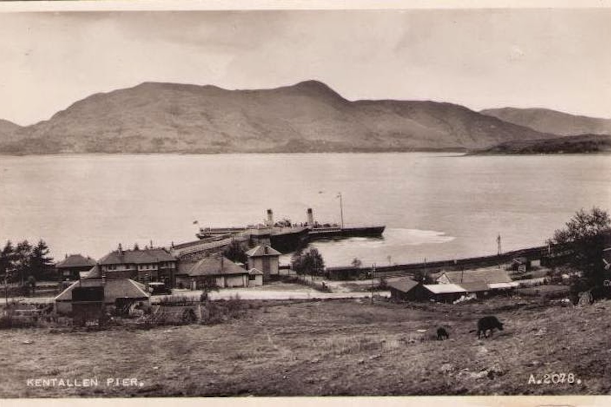 A paddle steamer docked at Kentallen Pier on an old postcard
