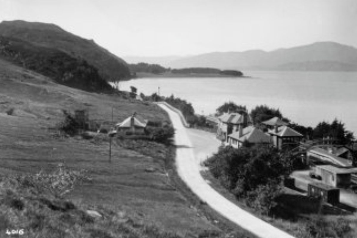 The railway line and the shore of Loch Linnhe at Kentallen, seen from the hillside above